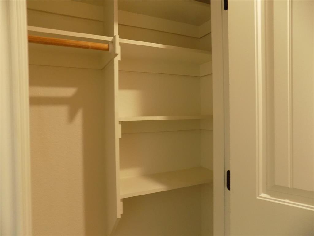 2007 Brown Loop Poolville, TX 76487 - Photo 4 of 32 a bathroom with a glass door