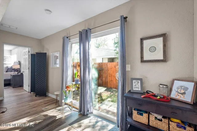 a bedroom with furniture and a window