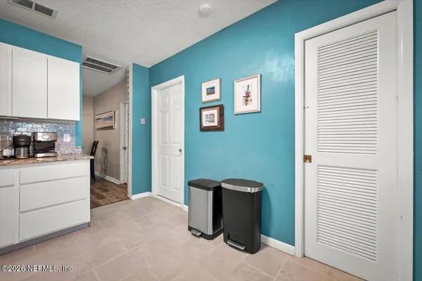 a kitchen with window wooden floor and white appliances