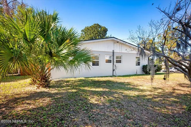 a bathroom with a sink and a yard