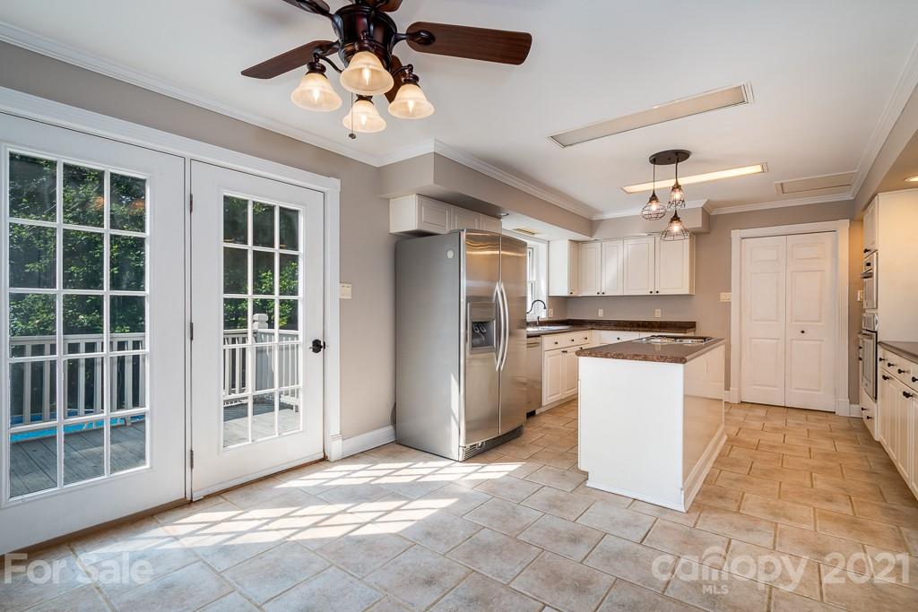 7230 Denmark Drive Denver, NC 28037 - Photo 15 of 41 a view of a kitchen with refrigerator and a ceiling fan