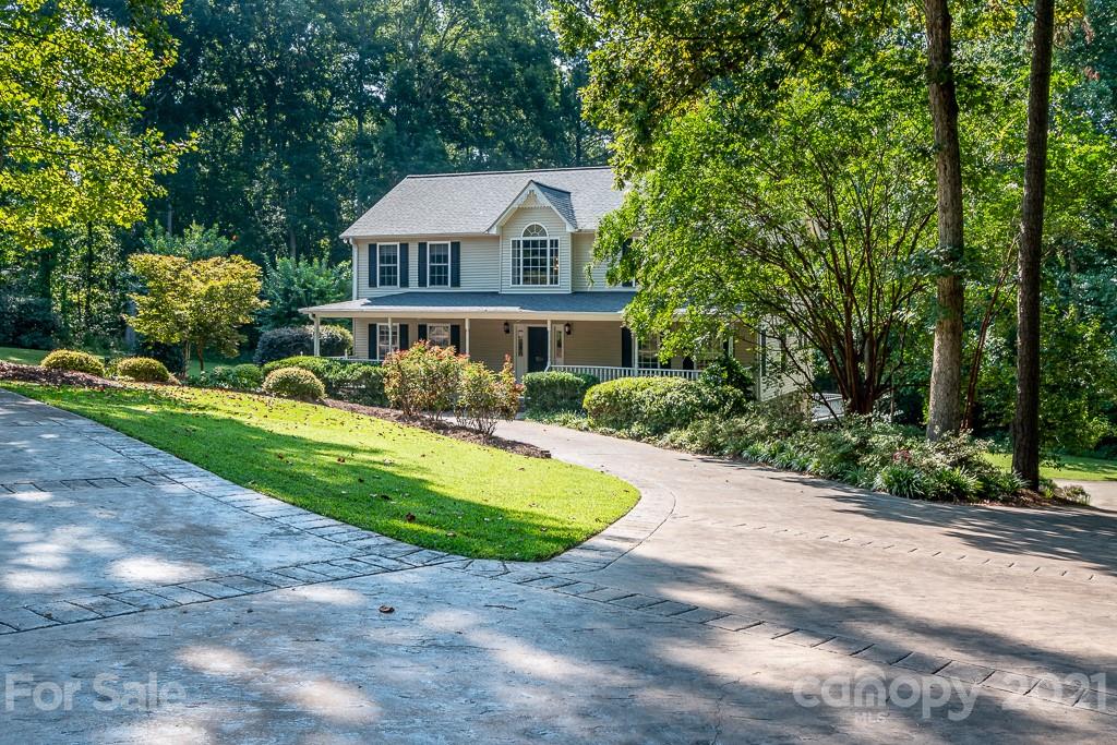 7230 Denmark Drive Denver, NC 28037 - Photo 3 of 41 a front view of a house with a yard