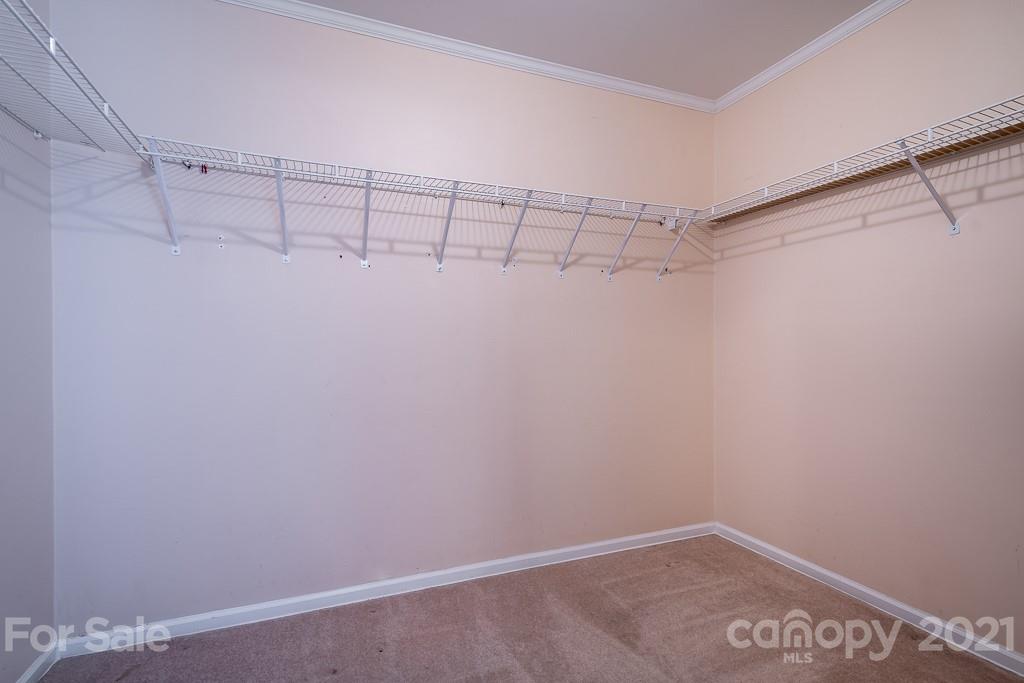 7230 Denmark Drive Denver, NC 28037 - Photo 21 of 41 a view of a room with racks on the wall