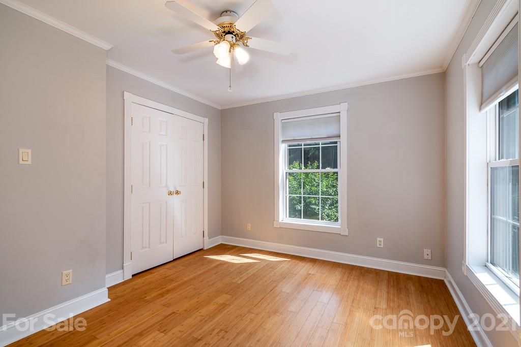 7230 Denmark Drive Denver, NC 28037 - Photo 24 of 41 an empty room with a window and wooden floor