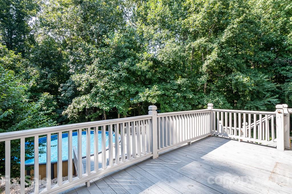 7230 Denmark Drive Denver, NC 28037 - Photo 28 of 41 a balcony with wooden floor and fence