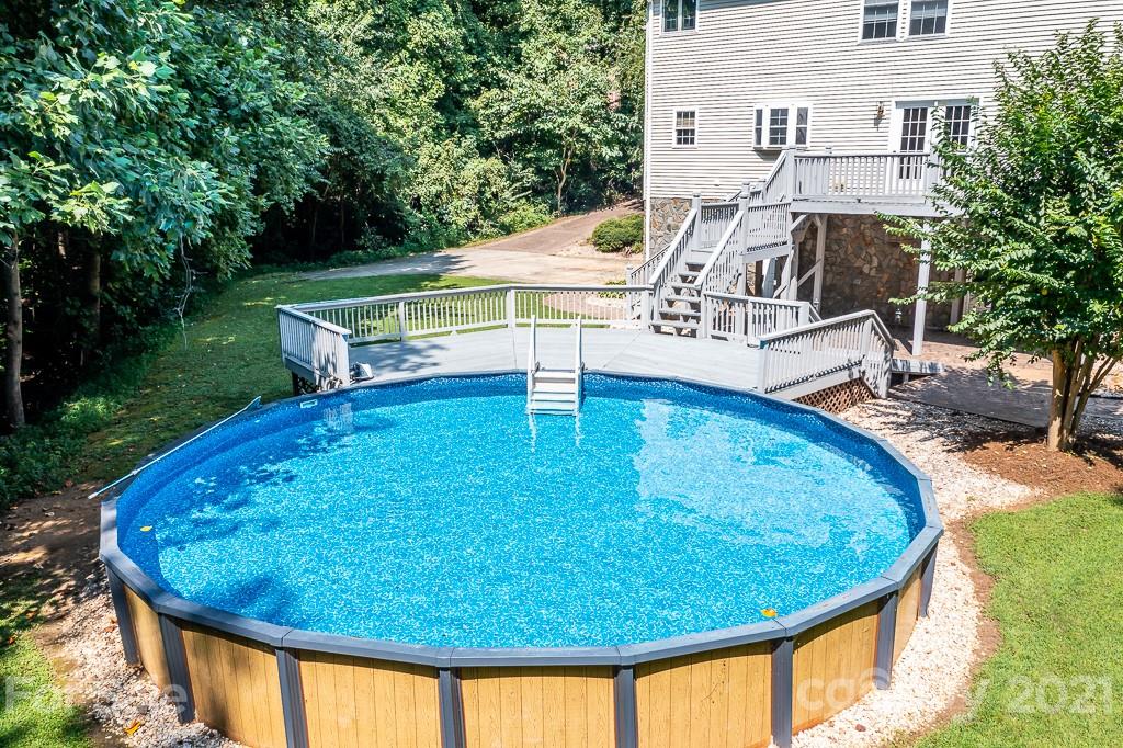 7230 Denmark Drive Denver, NC 28037 - Photo 34 of 41 a view of a swimming pool with an outdoor seating