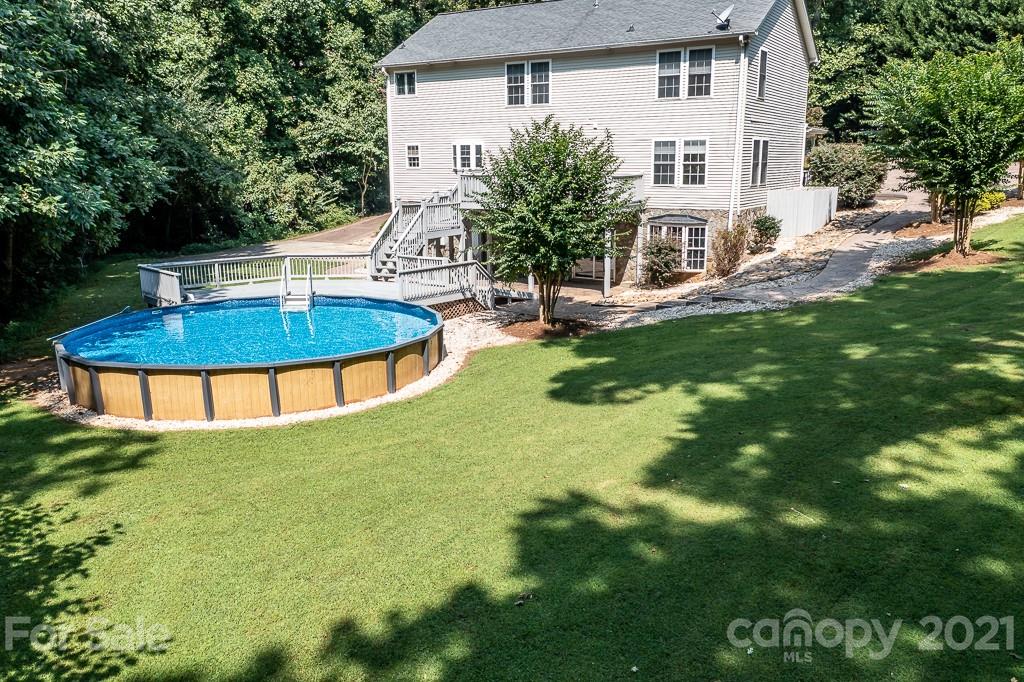 7230 Denmark Drive Denver, NC 28037 - Photo 35 of 41 a view of a house with a backyard porch and sitting area