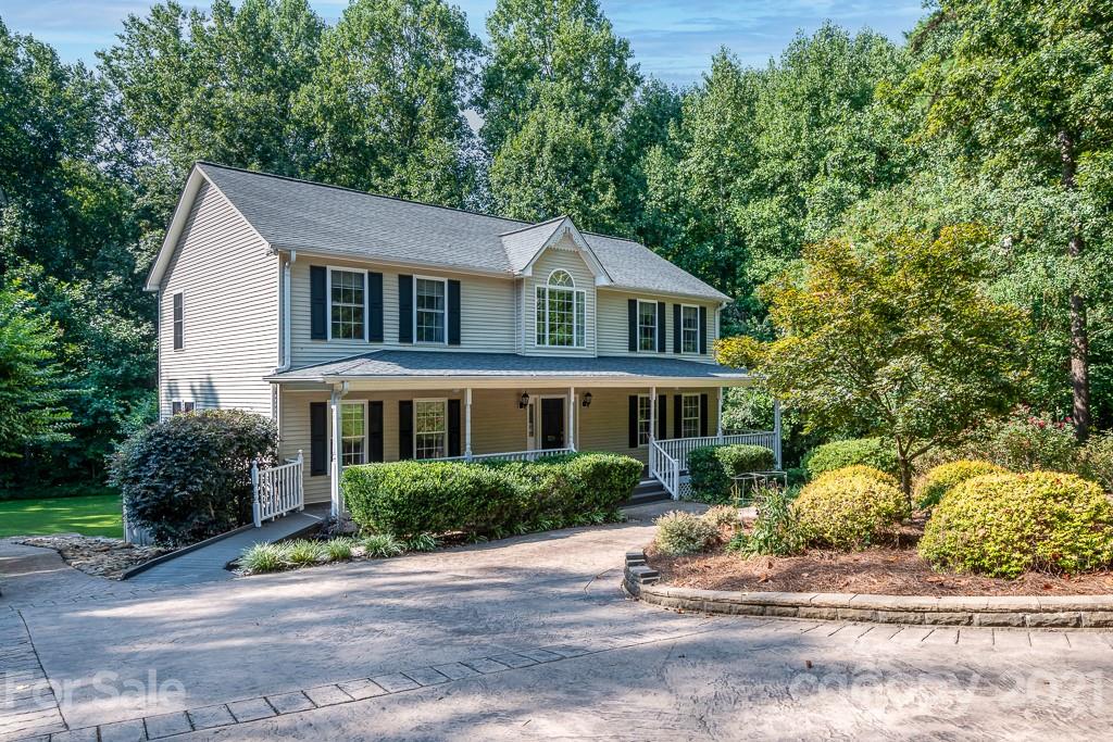 7230 Denmark Drive Denver, NC 28037 - Photo 5 of 41 a front view of a house with a garden