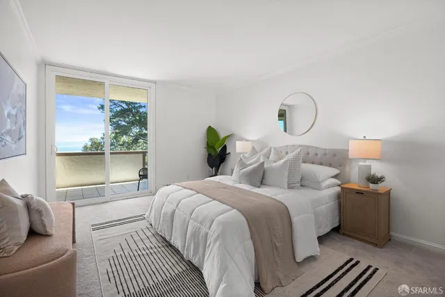 a view of a balcony with an outdoor seating