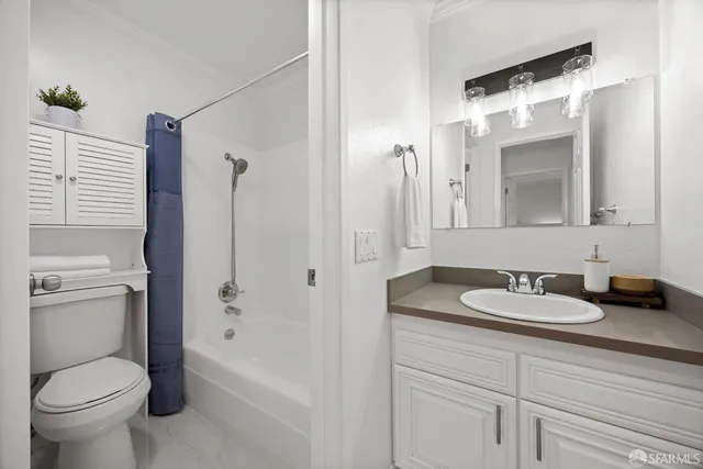 an aerial view of residential building and ocean