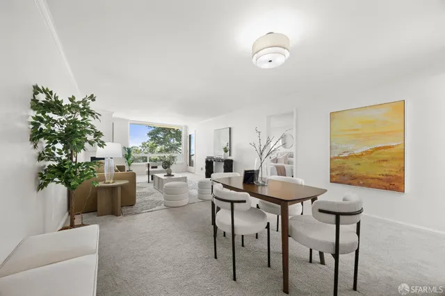 a living room with furniture a lamp and a large window