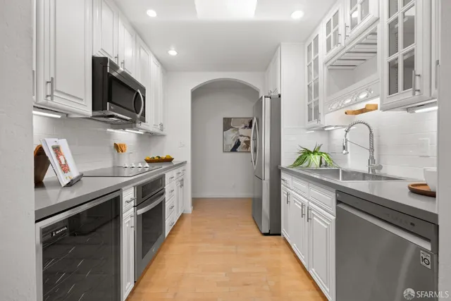 a kitchen with cabinets and window