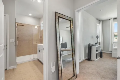 a bathroom with a glass shower door