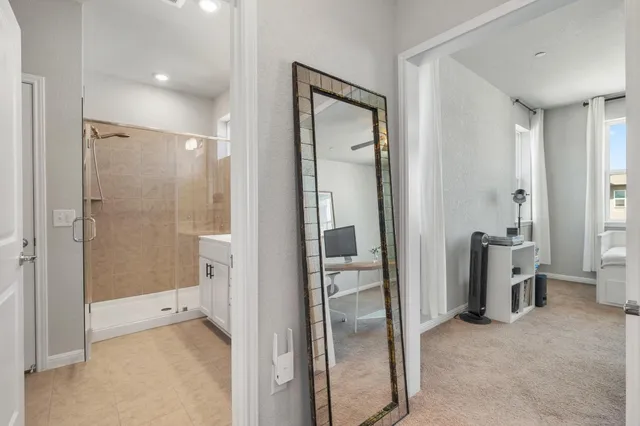 a bathroom with a glass shower door