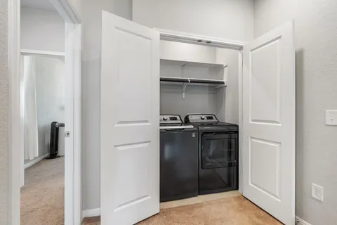 a kitchen with a refrigerator and a sink