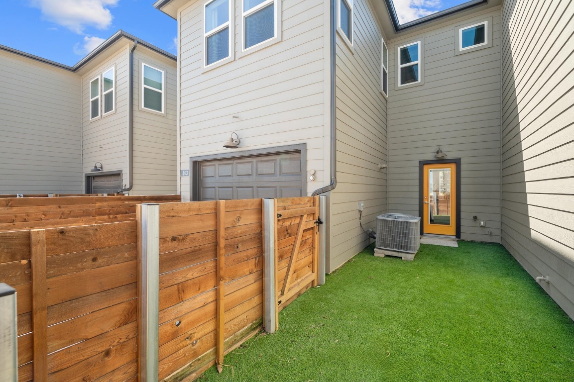 9015 Cattle Baron Path, Unit 403 Austin, TX 78747 - Photo 26 of 40 a view of a house with backyard
