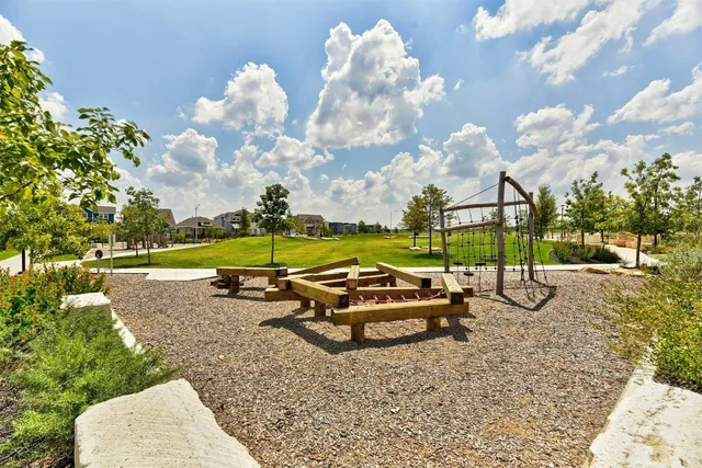 a view of a park with large trees