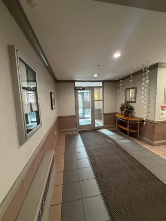 a picture of a living room with a rug