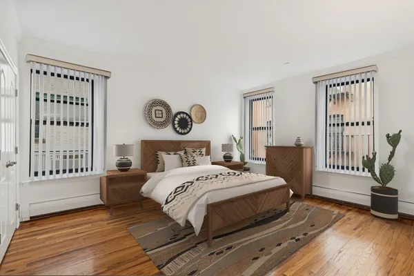 a view of a room with wooden floor