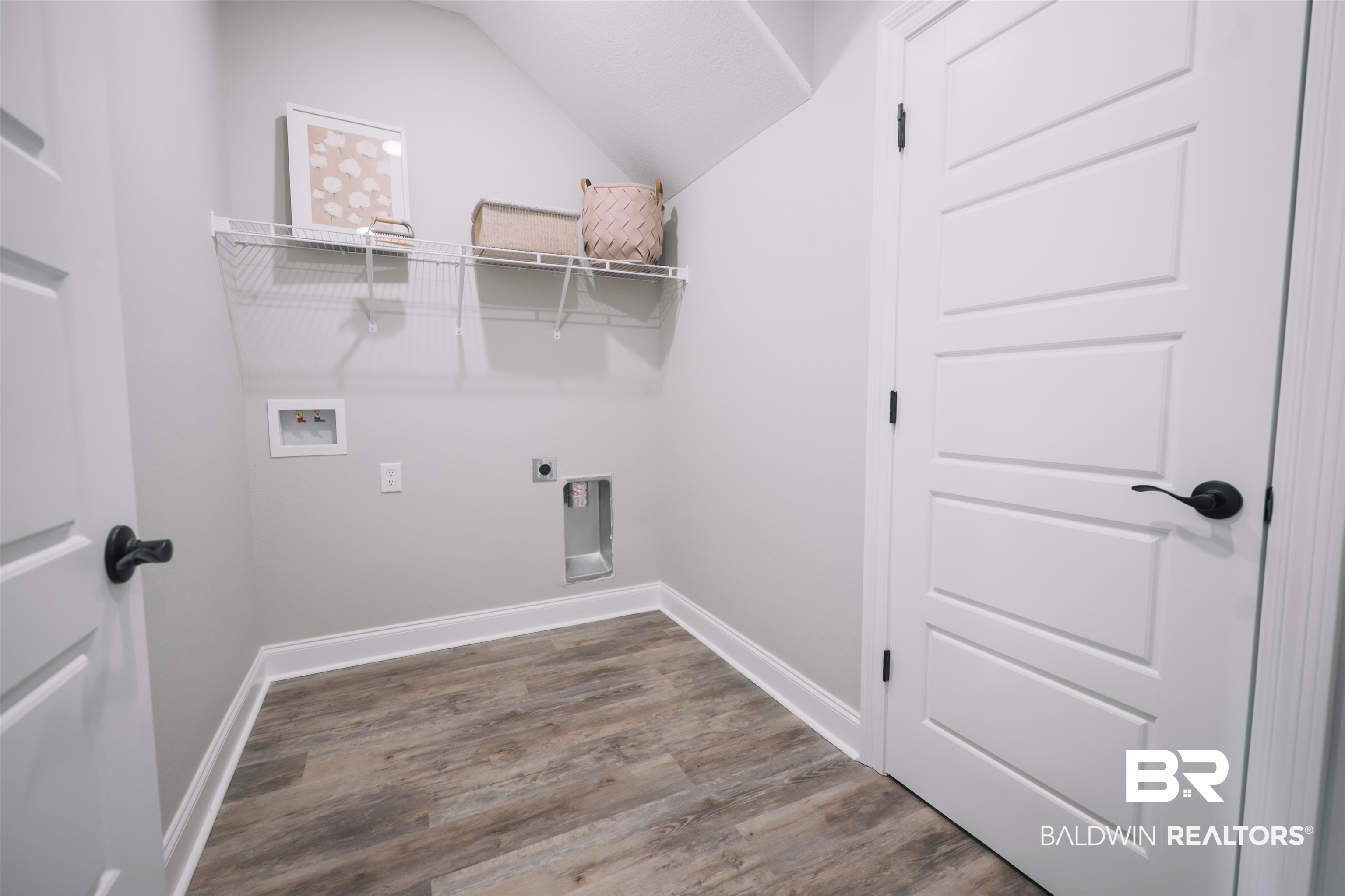 12894 Flanagan Street Elberta, AL 36530 - Photo 6 of 29 Washroom featuring wood-type flooring, hookup for an electric dryer, and washer hookup
