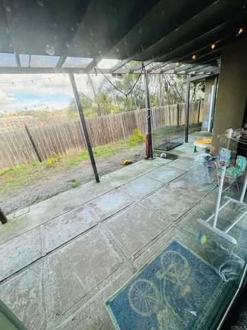 a living room with furniture and next to a window