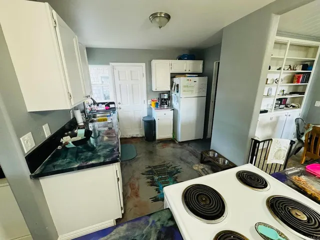 a kitchen with a stove and a sink