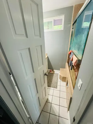 a bedroom with a large bed and a dresser