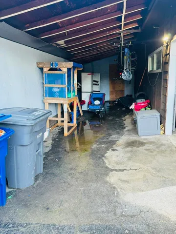 a view of backyard with a patio and a garden