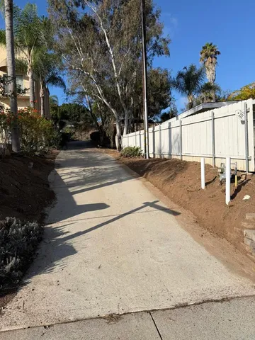 a view of a patio with table and chairs