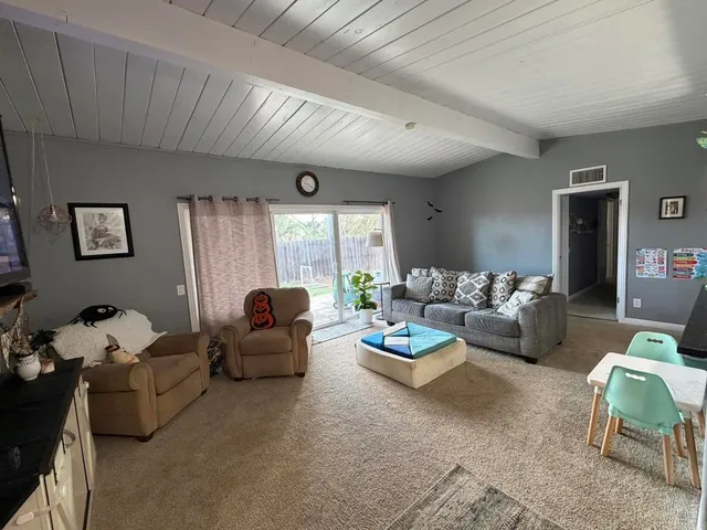 a bedroom with bed and window