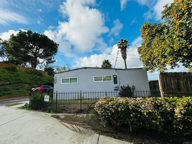 a view of a car park in front of house