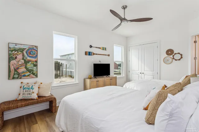 a bathroom with double vanity sinks and two mirror