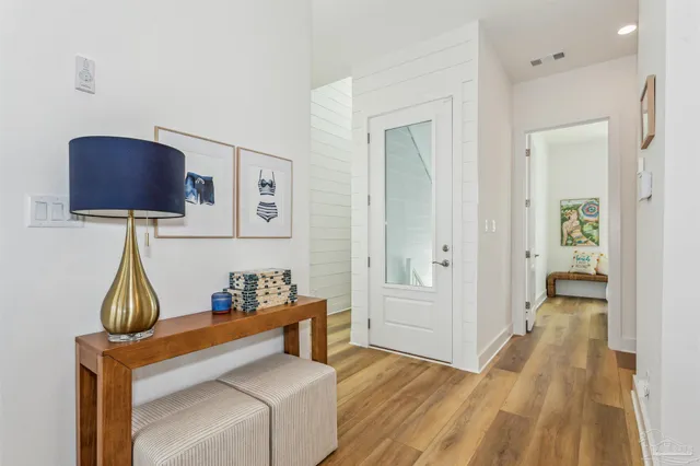 a view of room with furniture and wooden floor