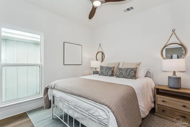 a bedroom with a bed and a walk in closet