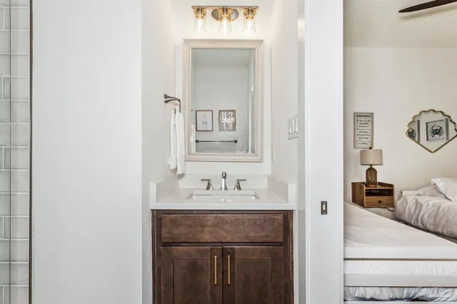 a bedroom with a bed a television and couch