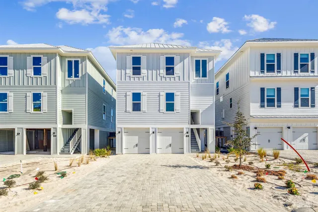 an aerial view of a house with a ocean view