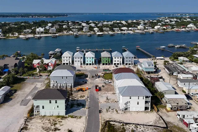 a view of a backyard with lawn chairs