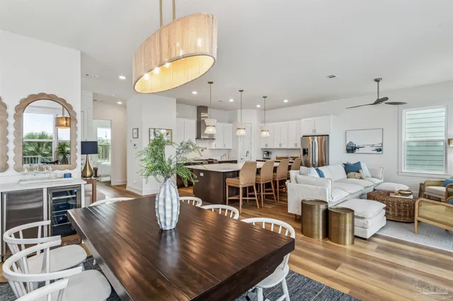 a large kitchen with stainless steel appliances granite countertop a sink a stove and a refrigerator