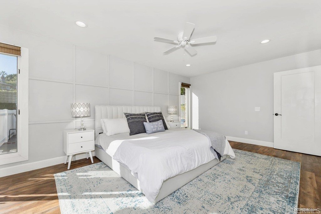 1815 Bailey Drive Oceanside, CA 92054 - Photo 15 of 34 a bedroom with a large bed and a chandelier