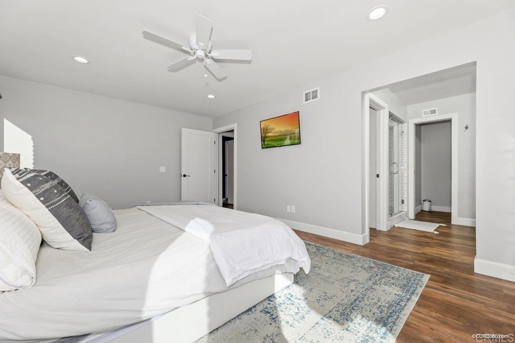 1815 Bailey Drive Oceanside, CA 92054 - Photo 16 of 34 a bedroom with a bed and a ceiling fan