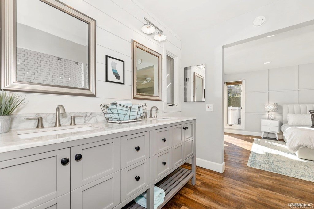 1815 Bailey Drive Oceanside, CA 92054 - Photo 17 of 34 a bathroom with double vanity sink a mirror and a shower