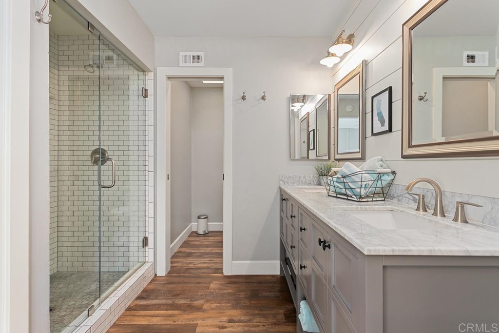 1815 Bailey Drive Oceanside, CA 92054 - Photo 18 of 34 a bathroom with a double vanity sink and mirror