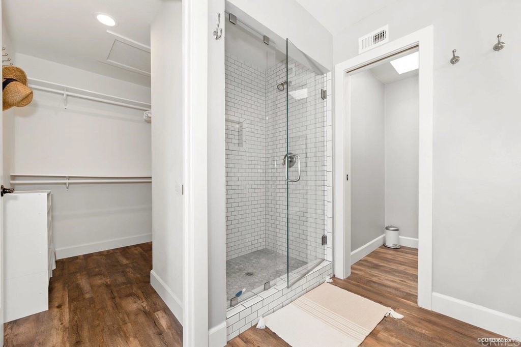 1815 Bailey Drive Oceanside, CA 92054 - Photo 19 of 34 a bathroom with a glass shower door and a bathtub