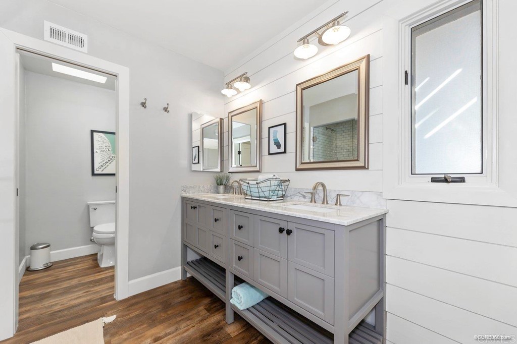 1815 Bailey Drive Oceanside, CA 92054 - Photo 20 of 34 a bathroom with a double vanity sink mirror and toilet