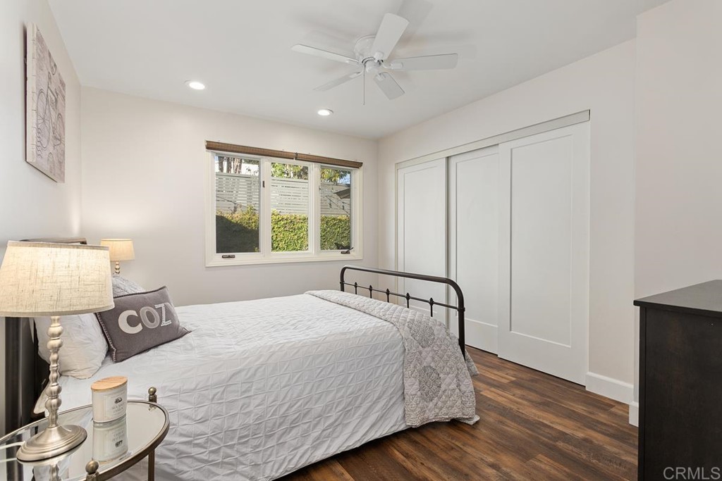 1815 Bailey Drive Oceanside, CA 92054 - Photo 21 of 34 a bedroom with a bed and wooden floor