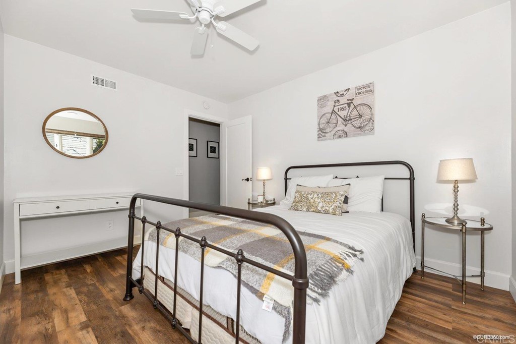 1815 Bailey Drive Oceanside, CA 92054 - Photo 22 of 34 a bedroom with a bed and a chandelier