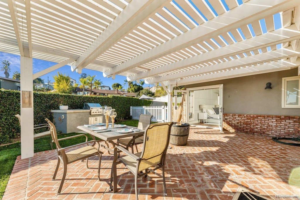 1815 Bailey Drive Oceanside, CA 92054 - Photo 30 of 34 a view of a patio with a table and chairs and potted plants