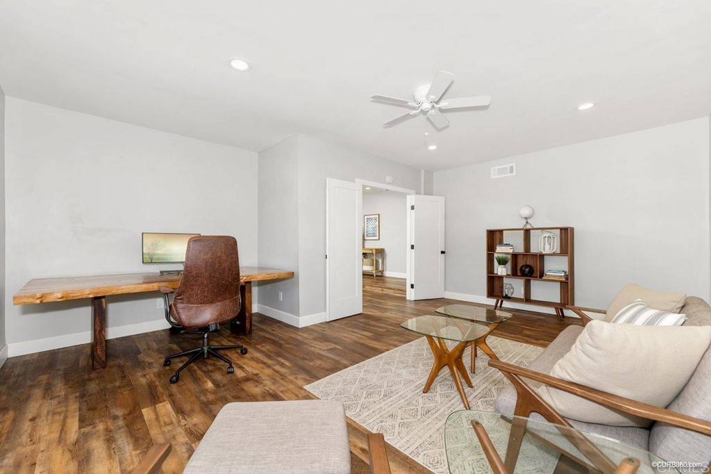 1815 Bailey Drive Oceanside, CA 92054 - Photo 9 of 34 a workspace with furniture and wooden floor