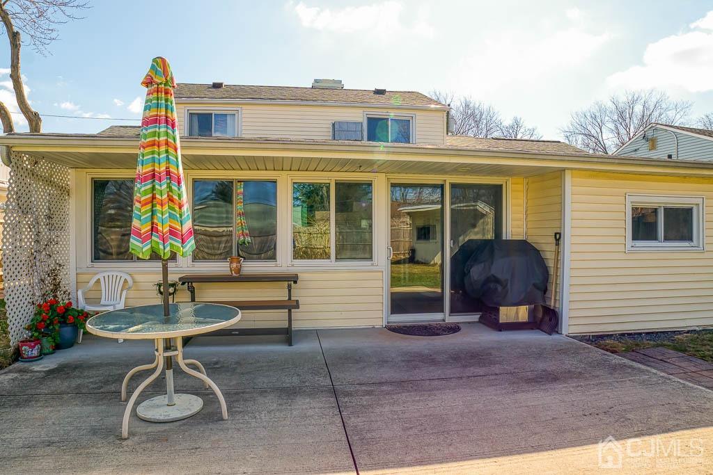 31 Windsor Road Edison, NJ 08817 - Photo 15 of 15 a view of a patio with table and chairs and potted plants