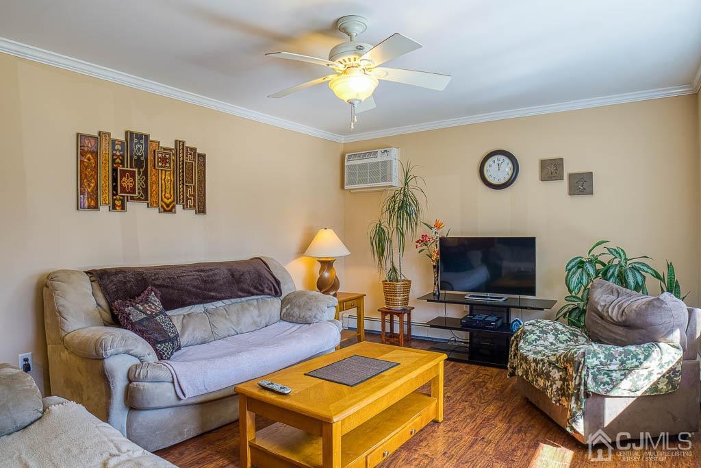 31 Windsor Road Edison, NJ 08817 - Photo 4 of 15 a living room with furniture a fireplace and a flat screen tv